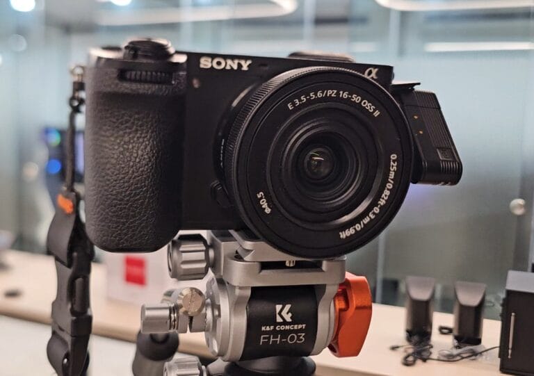 Product Review category: a Sony camera with a zoom lens mounted