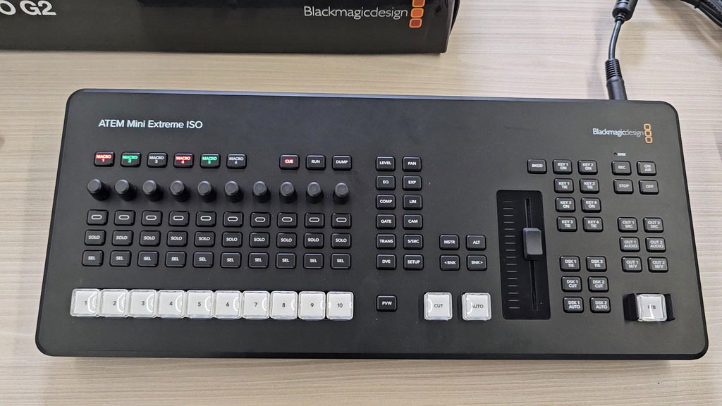 ATEM Mini Extreme ISO G2 control panel with macro buttons, audio knobs and source buttons