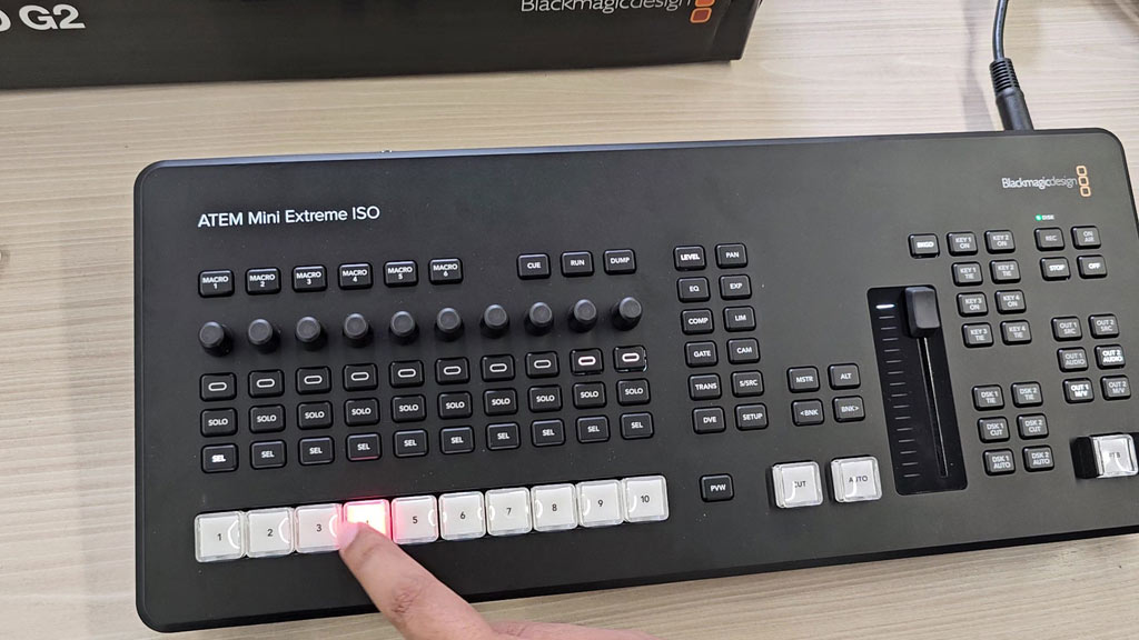 Selecting a source on the ATEM Mini Extreme ISO G2 with the lit source buttons