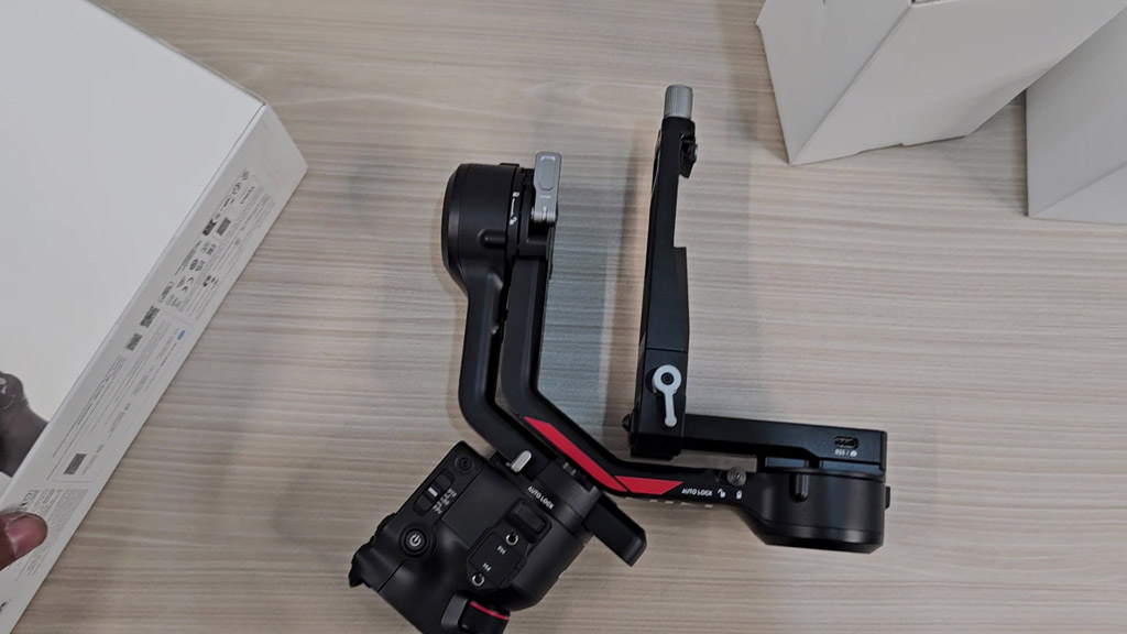 DJI RS 4 gimbal folded with its red Ronin accent
