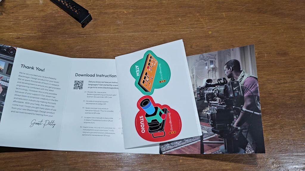 Welcome wallet opened to show the download instructions and QR code