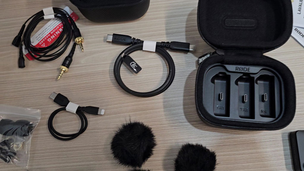 RØDE Wireless PRO charge case open showing the TX1, TX2 and RX slots