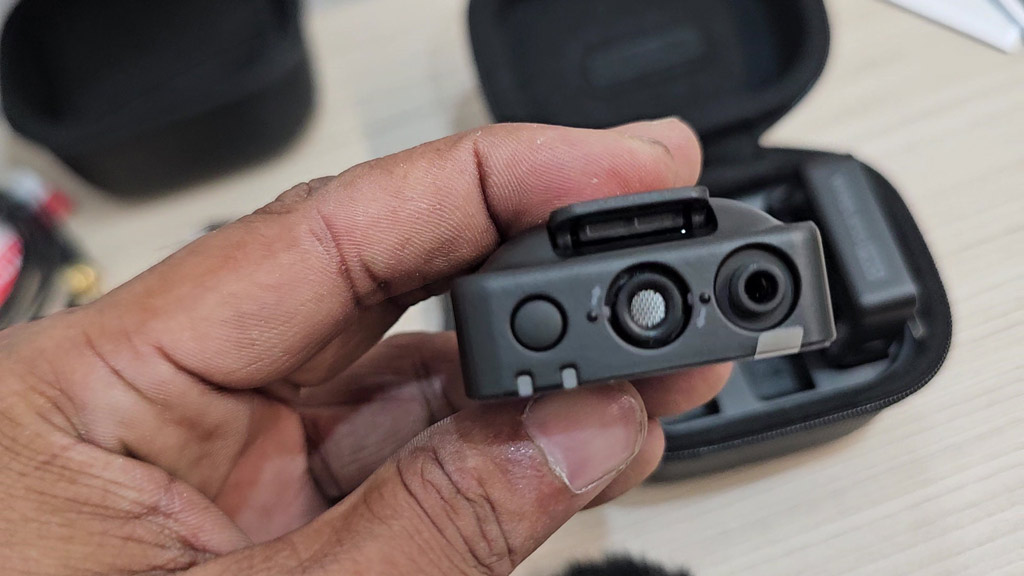 Top of a RØDE Wireless PRO transmitter with built-in microphone and locking 3.5mm input
