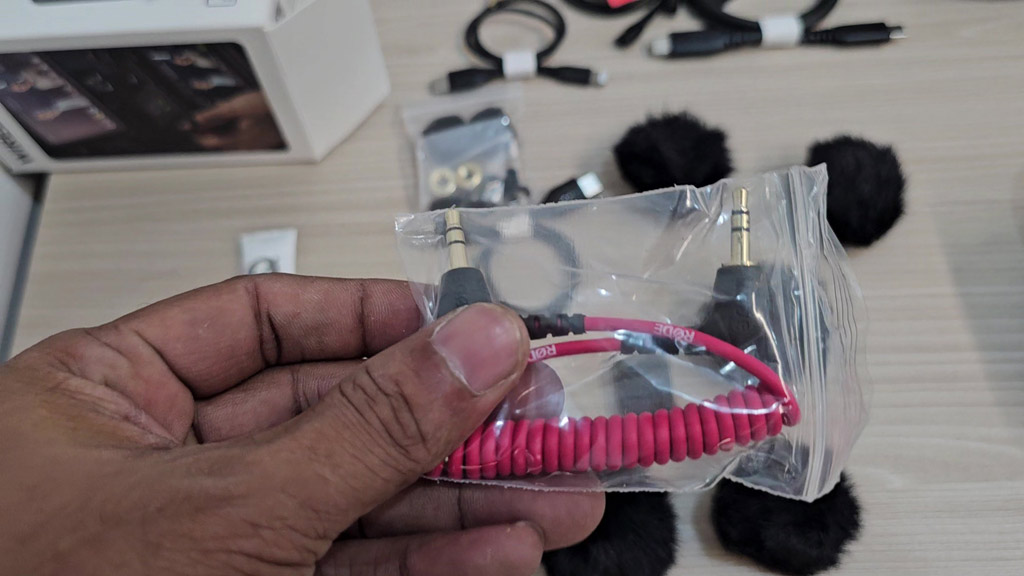 Red coiled 3.5mm TRS cable from the RØDE Wireless PRO kit