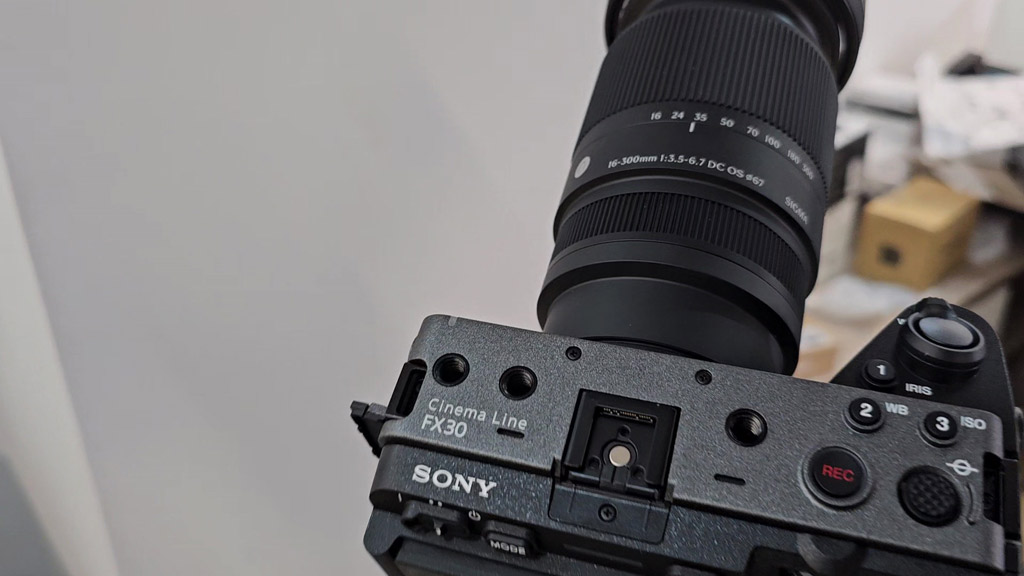 Sigma 16-300mm lens mounted on a Sony FX30 seen from above