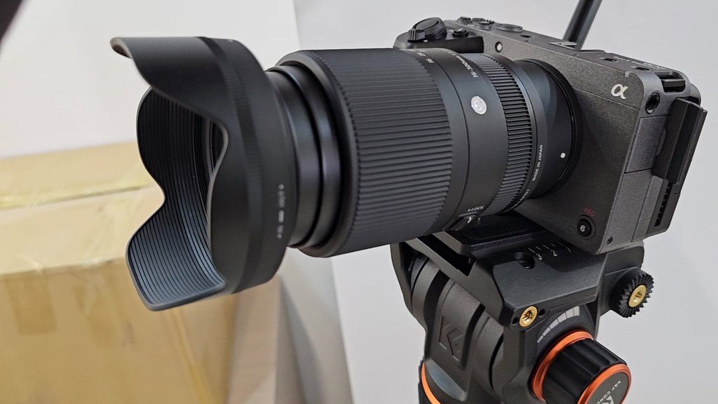 Sigma 16-300mm lens on a camera, side view